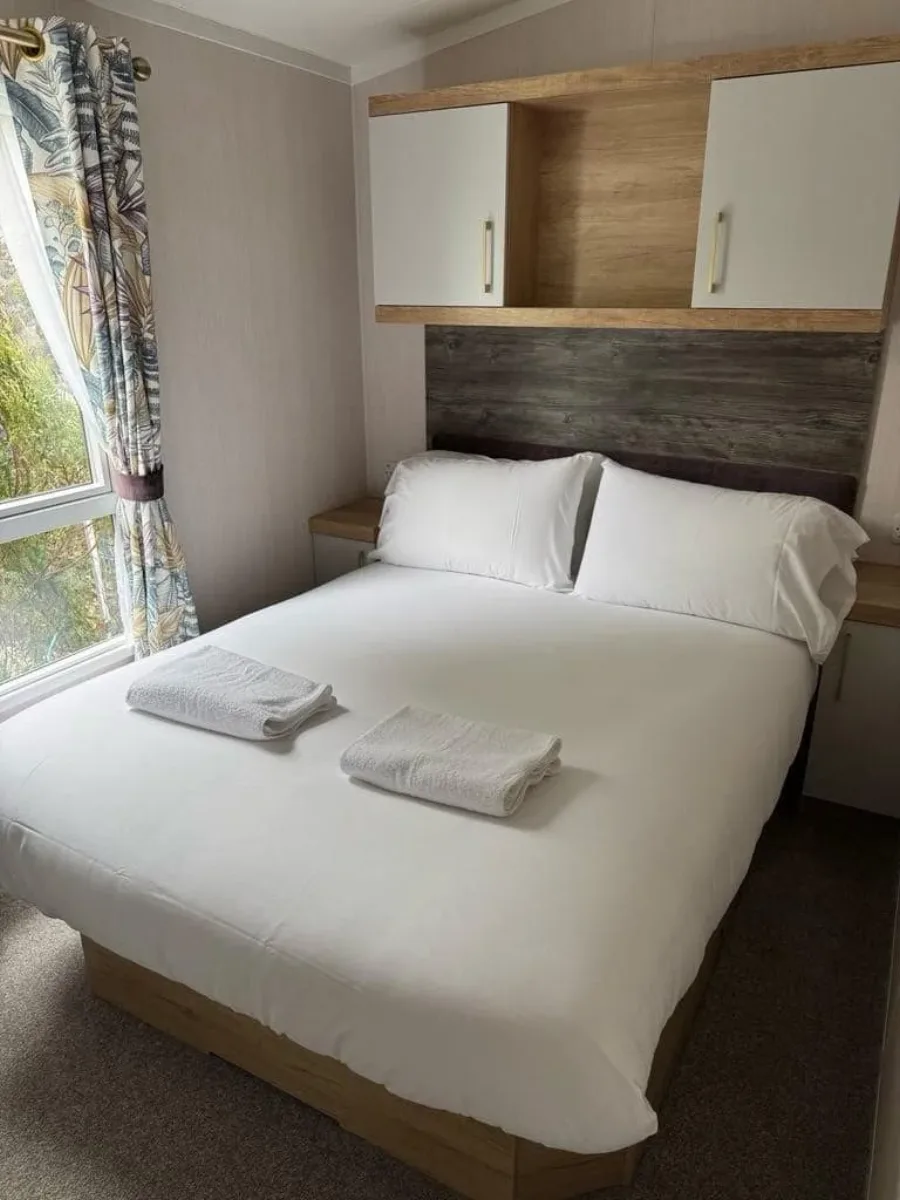 A caravan bedroom cleaned and prepared by Seren